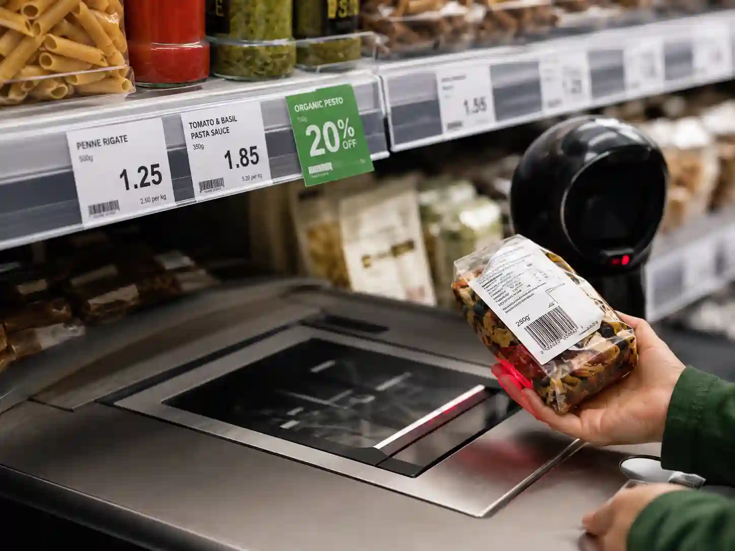 Scanning a package with Hy paper direct thermal label at a supermarket checkout.